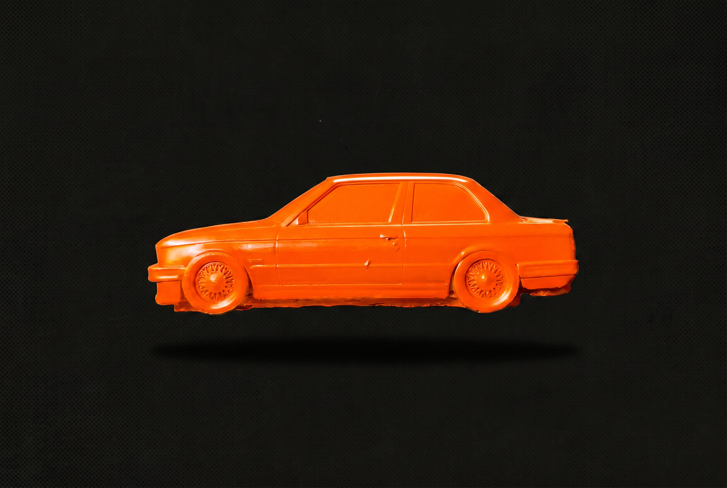 No. 001 Hazard — the actual high-gloss orange saloon, side profile on charcoal