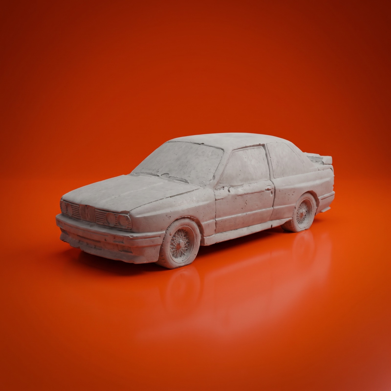 The '80s concrete sports saloon on an orange studio backdrop